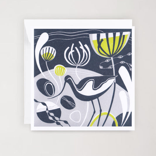 A square greetings card featuring a blue and grey lino print design with green accents, depicting an avocet amidst stylized foliage.