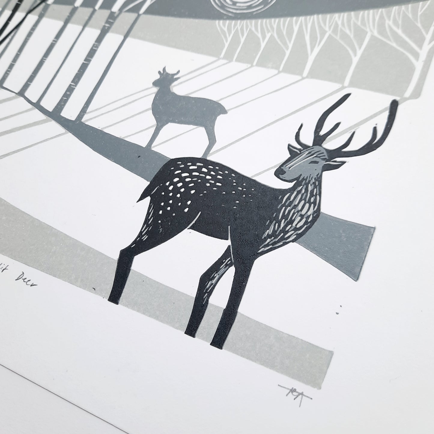 Close up of lino print deer in winter scene