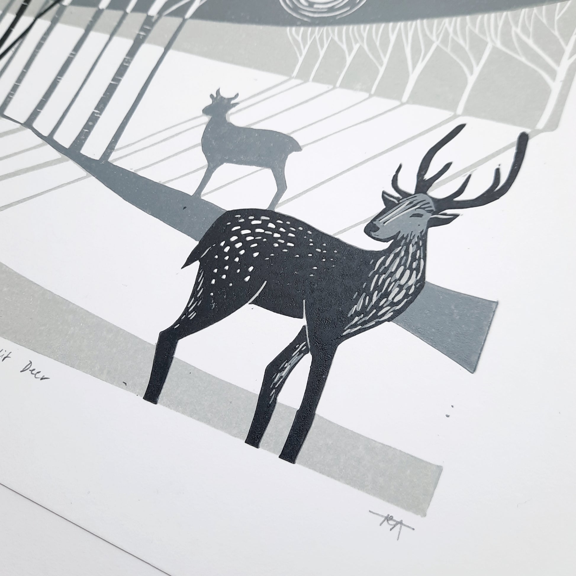 Close up of lino print deer in winter scene