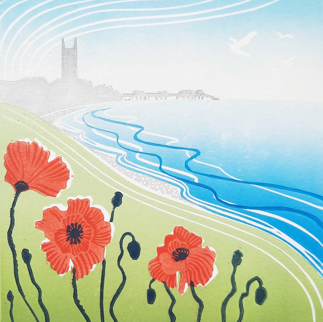 A view of Poppies on the cliff top with Cromer church in the hazy distance.